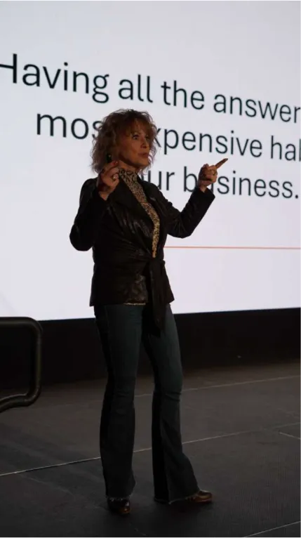 A speaker presenting to the room